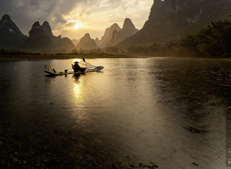 Kormoranfischer im Sonnenuntergang